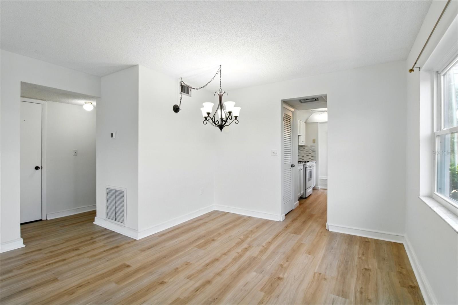DR to hallway on left and kitchen on the right