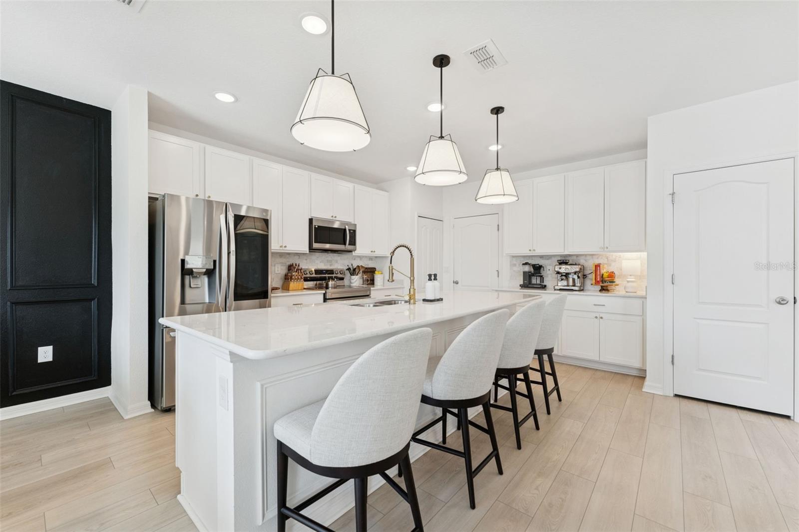 Quartz counters, 9' Foot island, soft-close Shaker-style cabinets