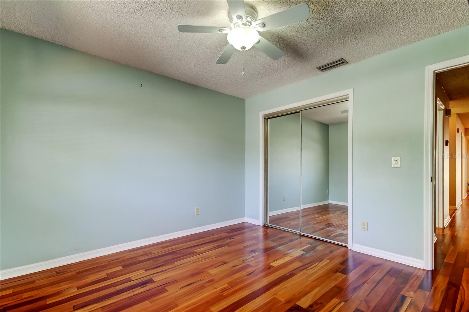 12a. Bedroom #2 (11.1 x 11.1') at End of the Hall, Front of Home, Painted a Calming Blue w Full Size Closet, Ceiling Fan.