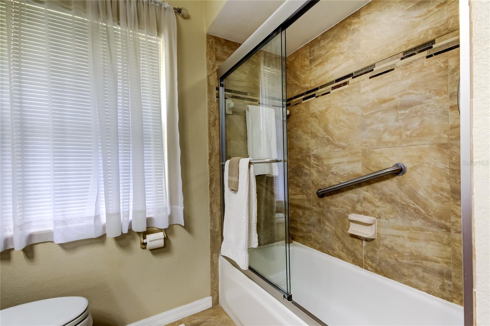 15 Guest Bathroom (7.5 x 8.7') FULLY UPDATED, Cohesive Design w Kitchen & Primary Bathroom.. Tastefully Tiled Tub w Shower Combo