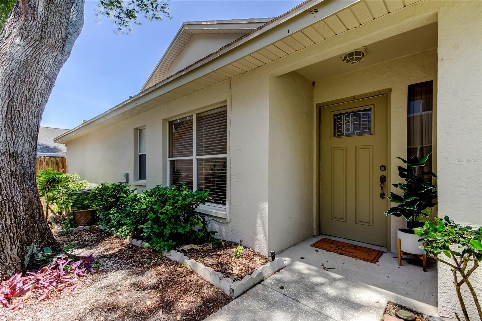 19c. Front Porch is Covered, Landscaping is Fla Style, Low Maintenance.. But Sure is Pretty!