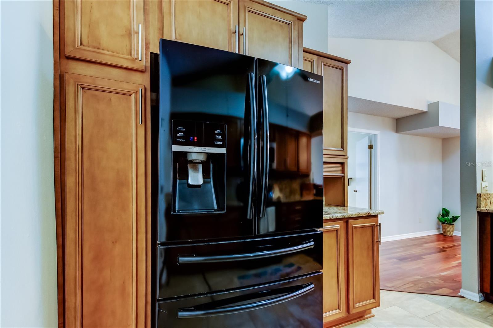 4. High Quality Black Fridge w Indoor H2O Service,  Surrounded by Custom Cabinetry.. Pantry w Pull Out Draws, Appliance Shed..