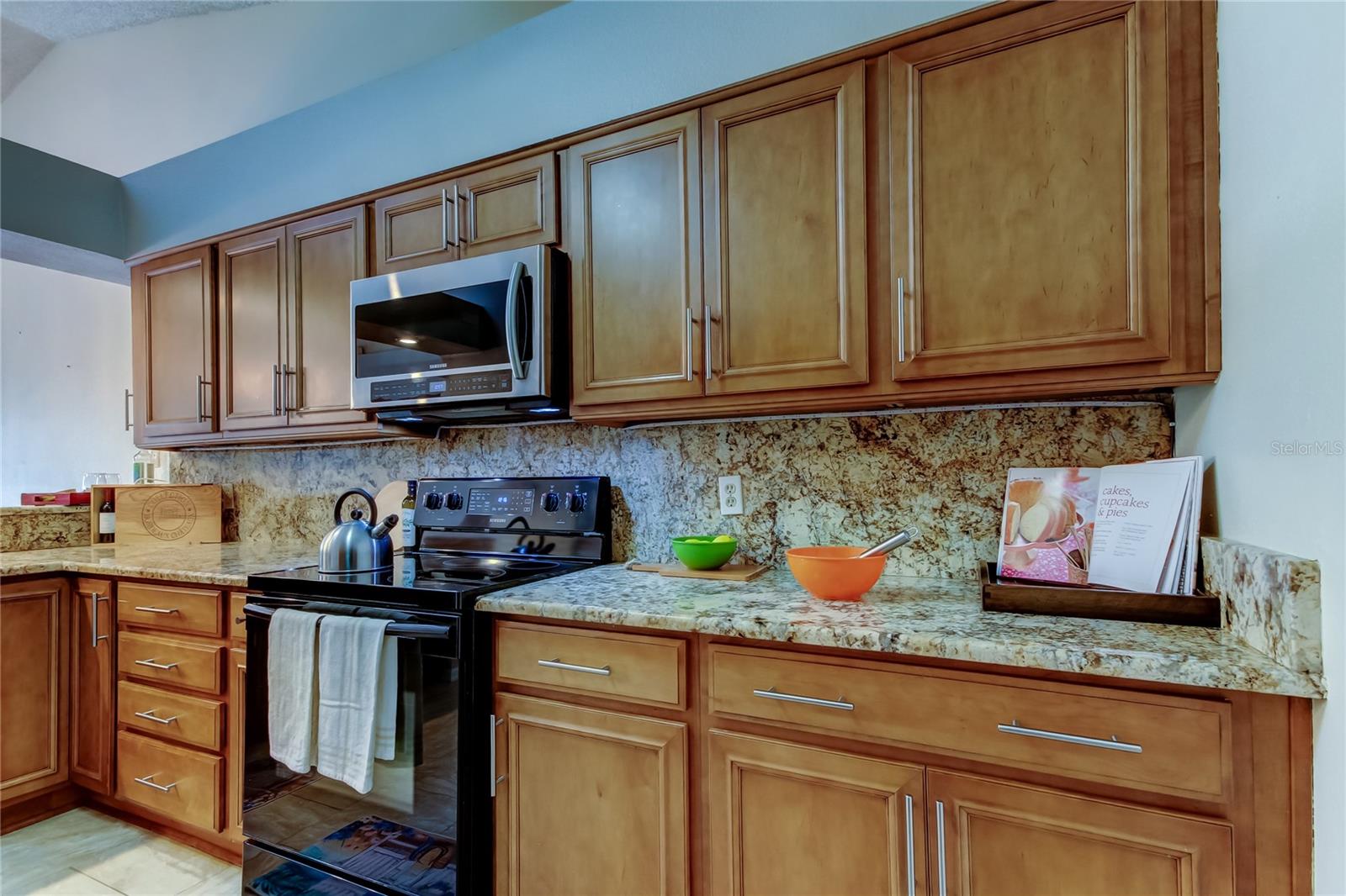 25.  Full Wall of Uppers & Lower Cabinets = LOADS of COUNTER SPACE!! Invite Friends or Family to Join You (10.9 x 12.9')
