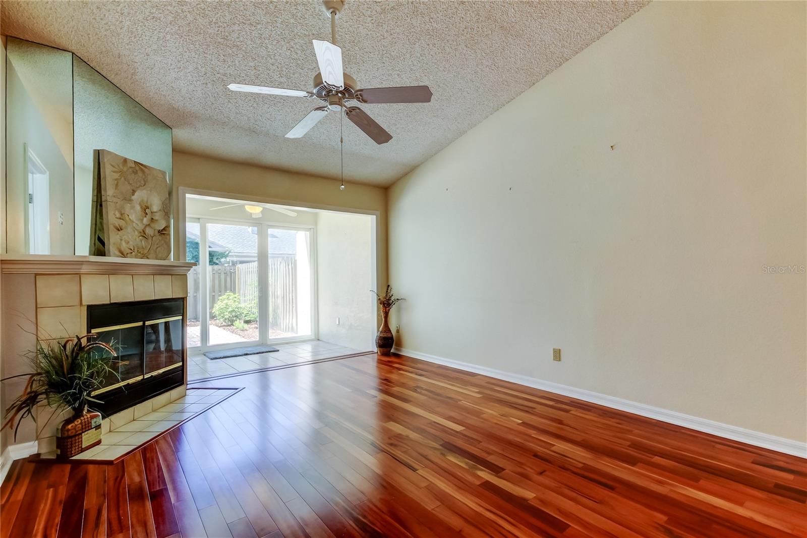34. Living Area (12.6 x 14.11') Feels Spacious, Features a Wood Burning Fireplace at Helm, + Opens to Bonus Area (8.1 x 9.11')!