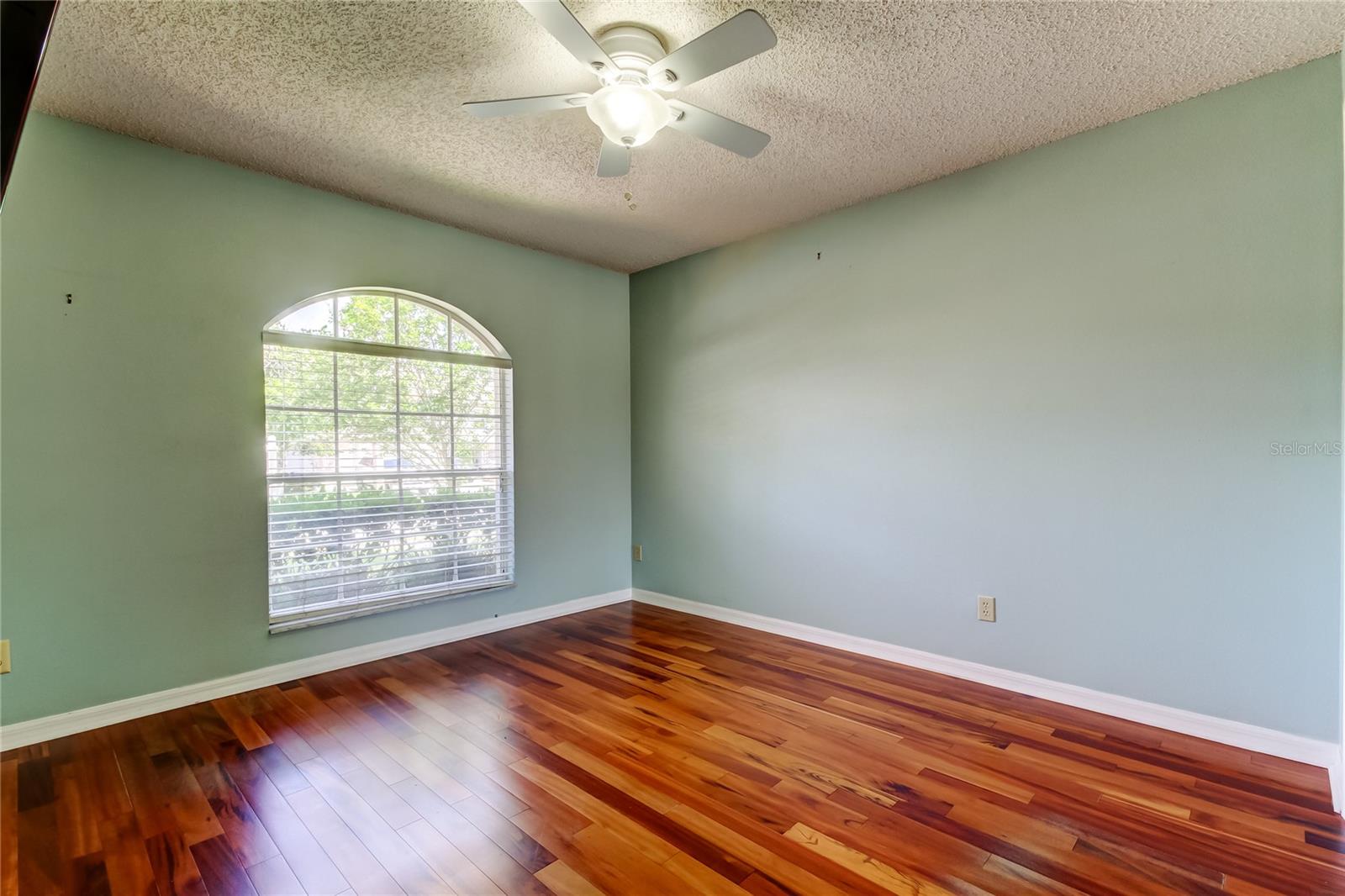 49. Bedroom #2 (11.1 x 11.1') is at Front of Home, Painted a Calming Blue with a Snazzy Arched Window!!