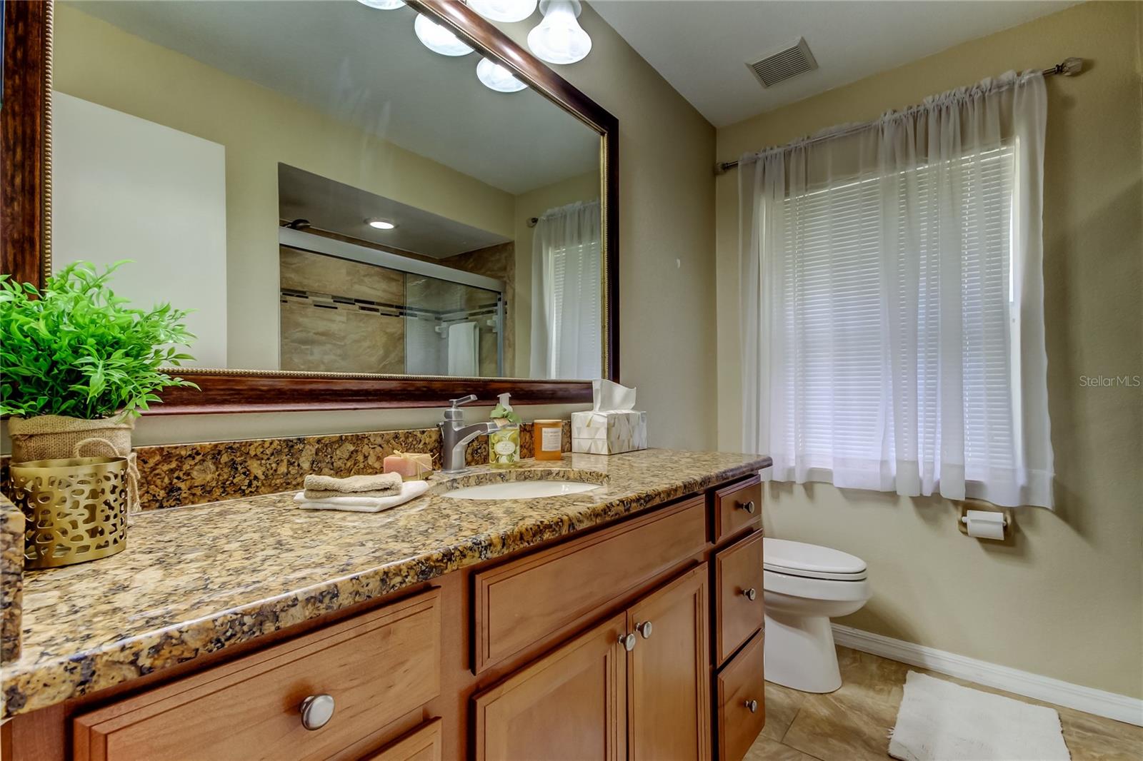 56. Bathroom #2 in Hallway (7.5 x 8.7') Matches the Tastefully Updated Kitchen Beautifully! Tastefully Tiled Shower & Tub Combo!