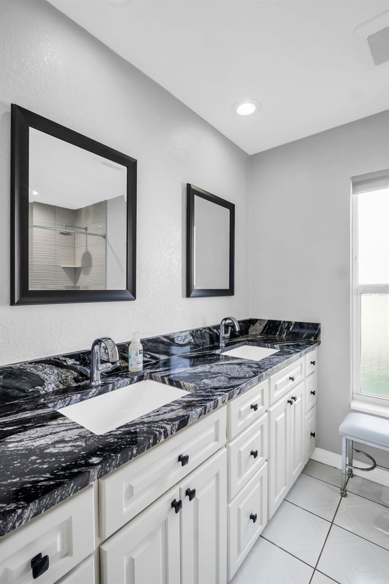 Primary bedroom's stunning ensuite with dual vanities