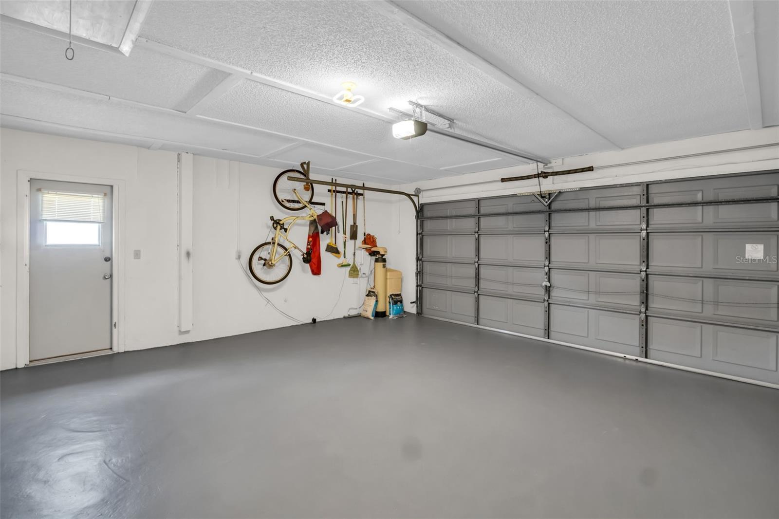 with pull down stairs to attic, painted floor