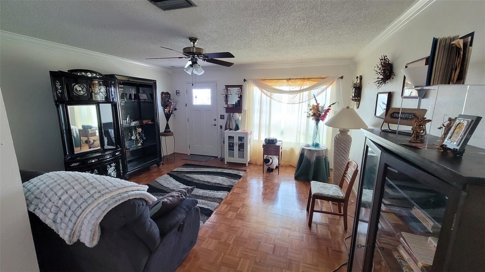 Step into this 14X15 living Area with beautiful parquet floors.