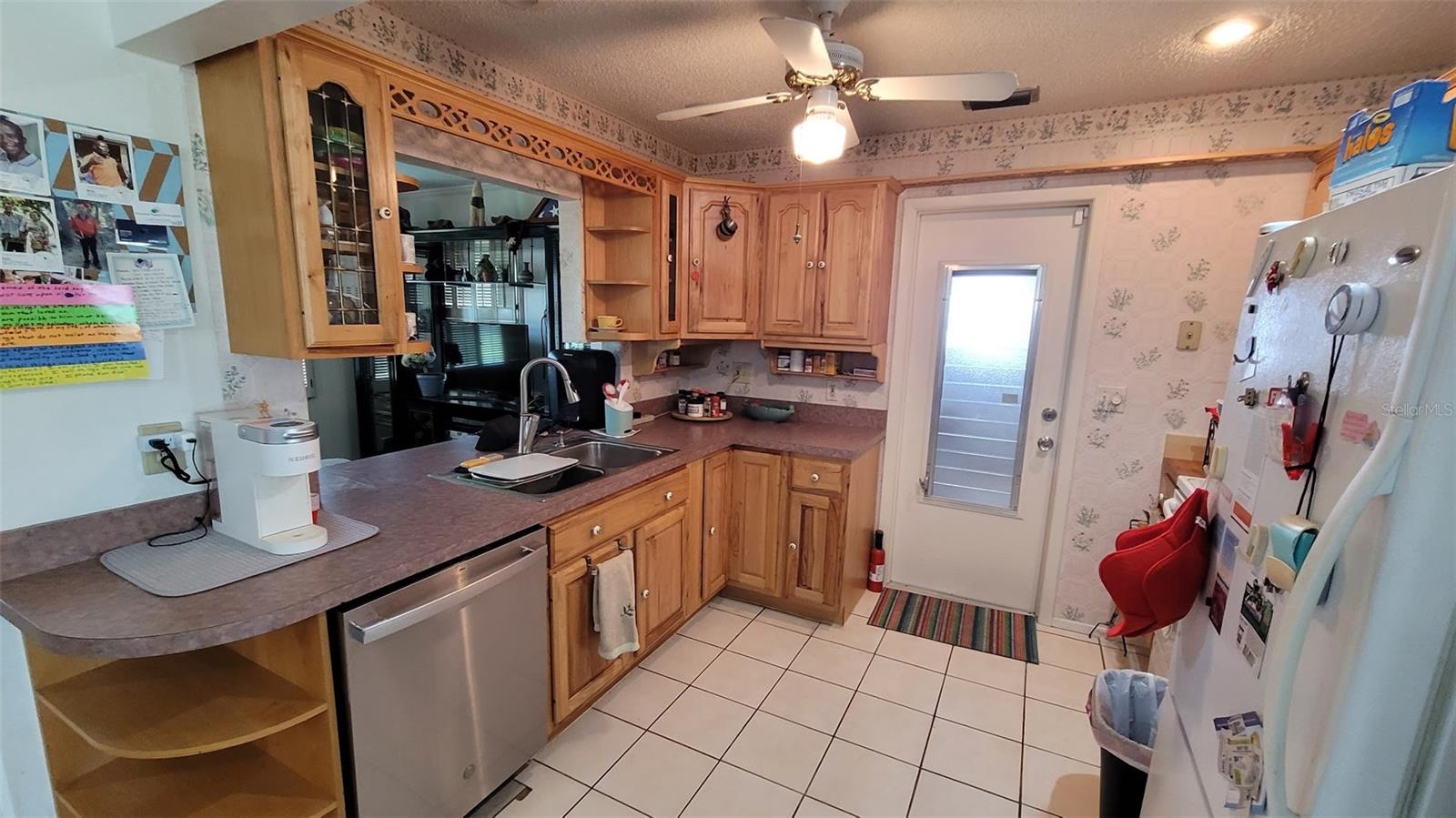 The kitchen was remodeled 10 or so years ago with hardwood cabinets and laminate counter tops.