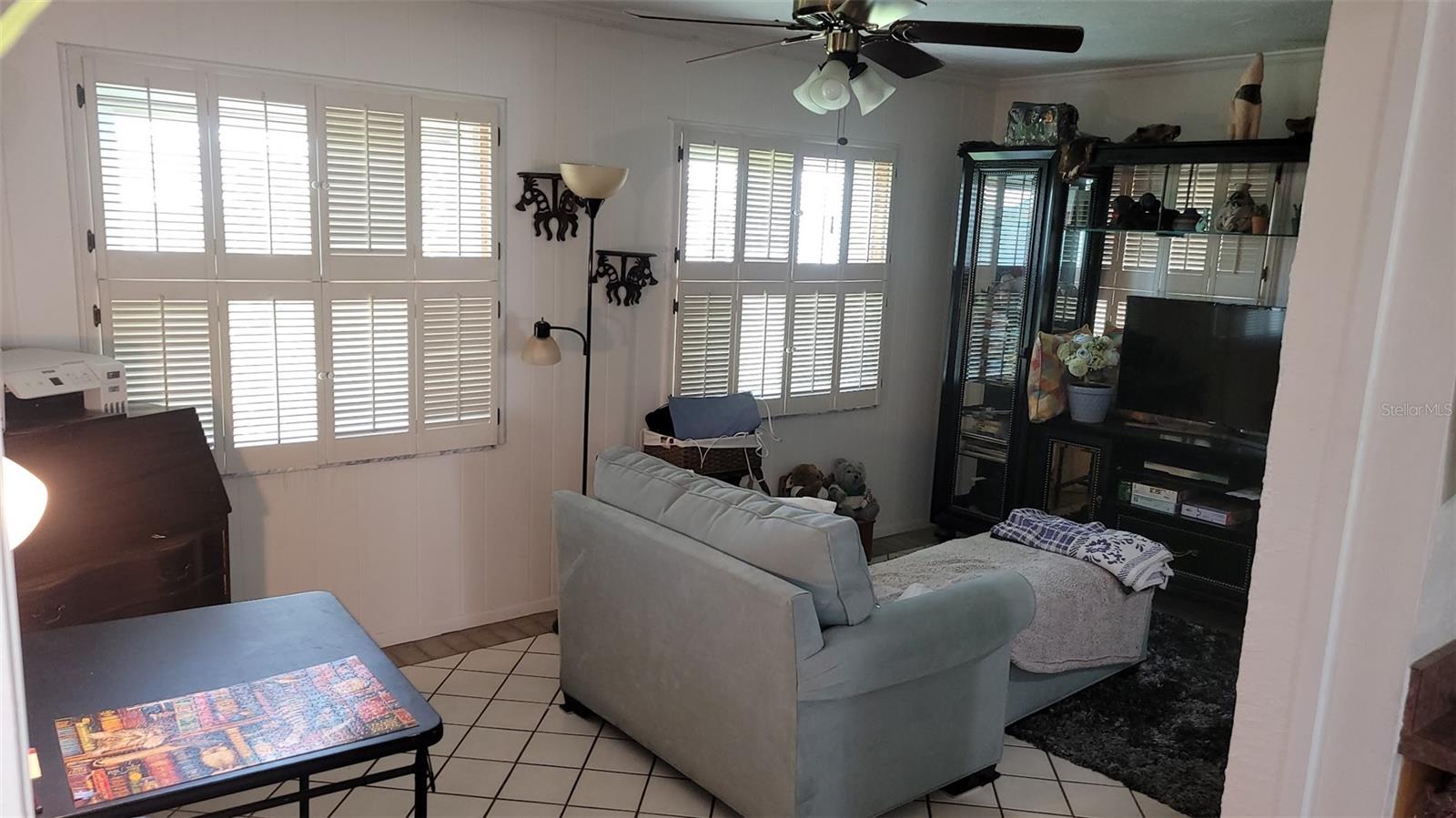 This 11X18 Florida Room is located just off the kitchen and has a pass thru window to the kitchen.