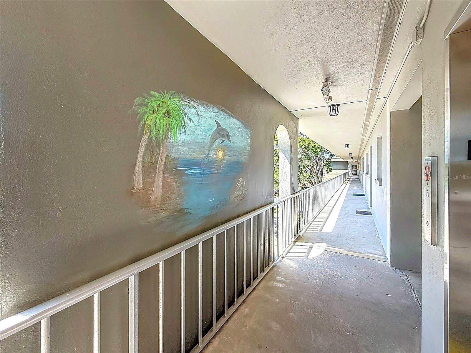 Third floor walkway leads from elevator to #305.