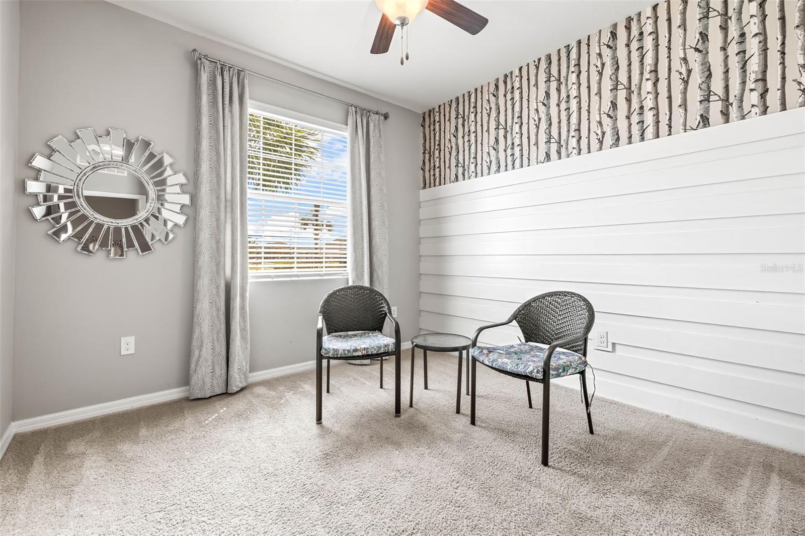Bedroom 3 sits to the front of the property with park view & gorgeous accented wall.