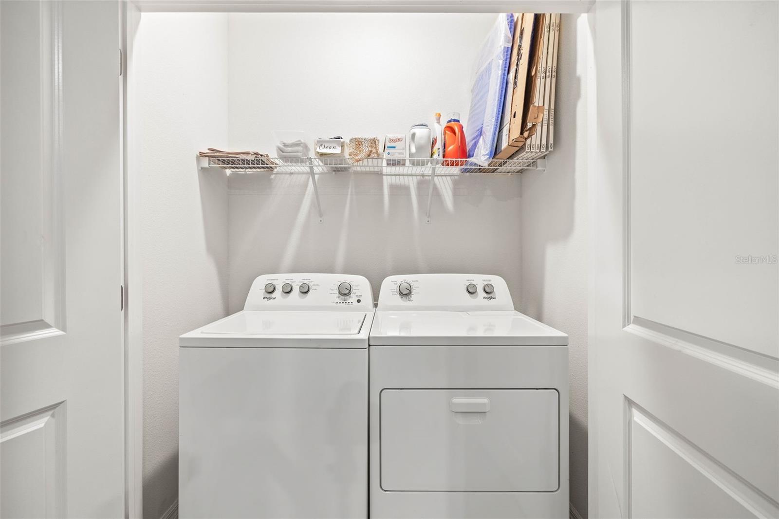Laundry closet off of kitchen.