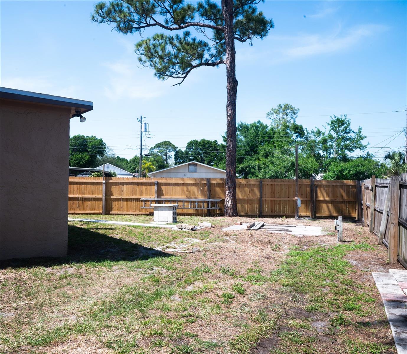 Back yard showing area for RV or Boat parking with the 50 Amp electrical outlet.