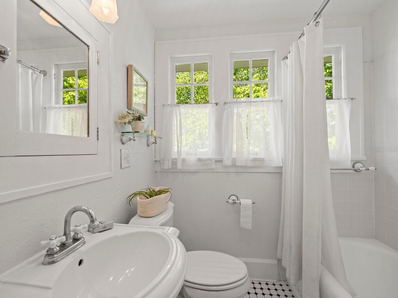 Stylish guest bathroom upstairs.