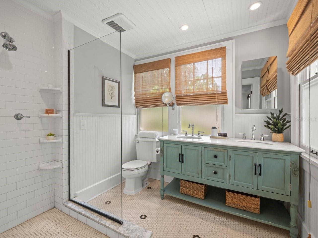 Stunning primary bathroom with walk-in shower.