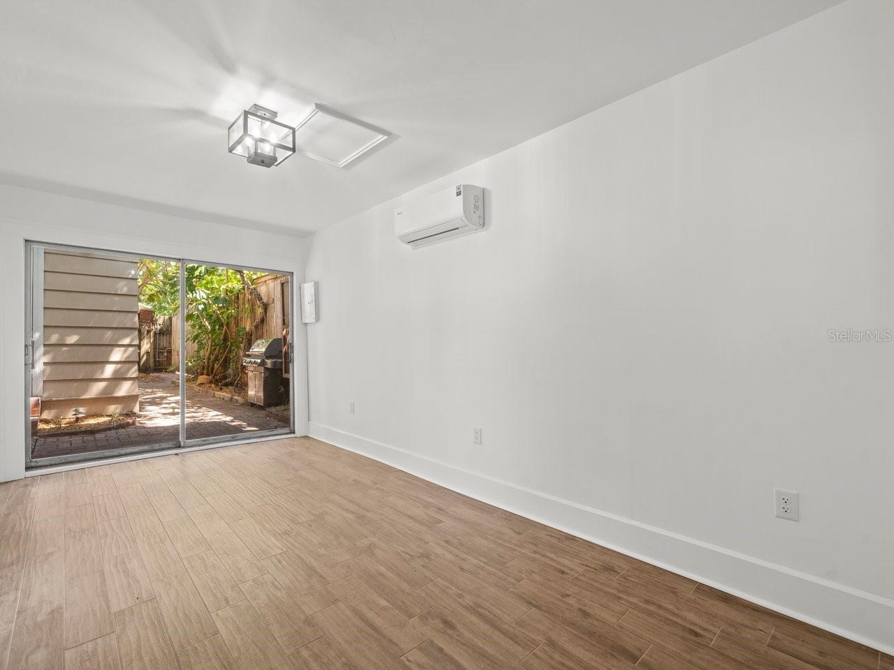 Remodeled flex room located just off the pool area.