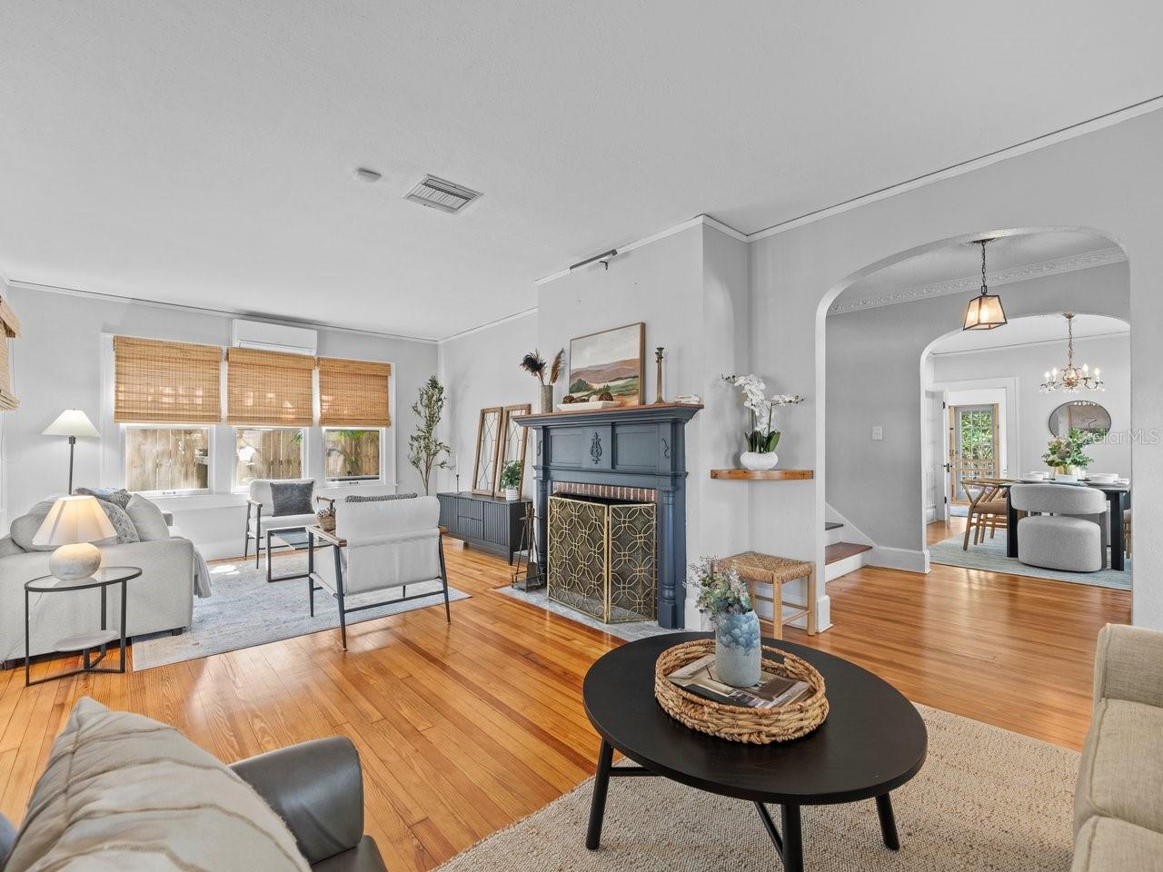 Formal living room with wood burning fire place.