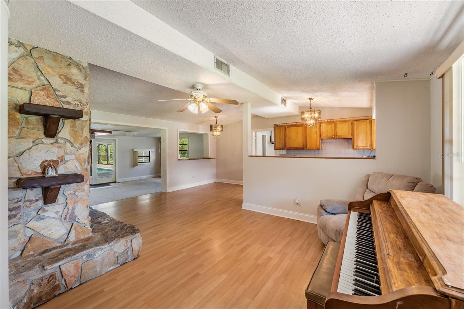 View a you enter the home, living room, kitchen and family room