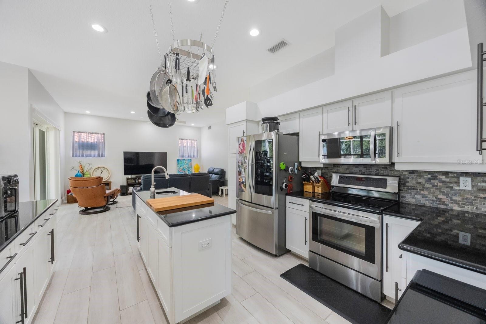 Gourmet kitchen open to the family room.