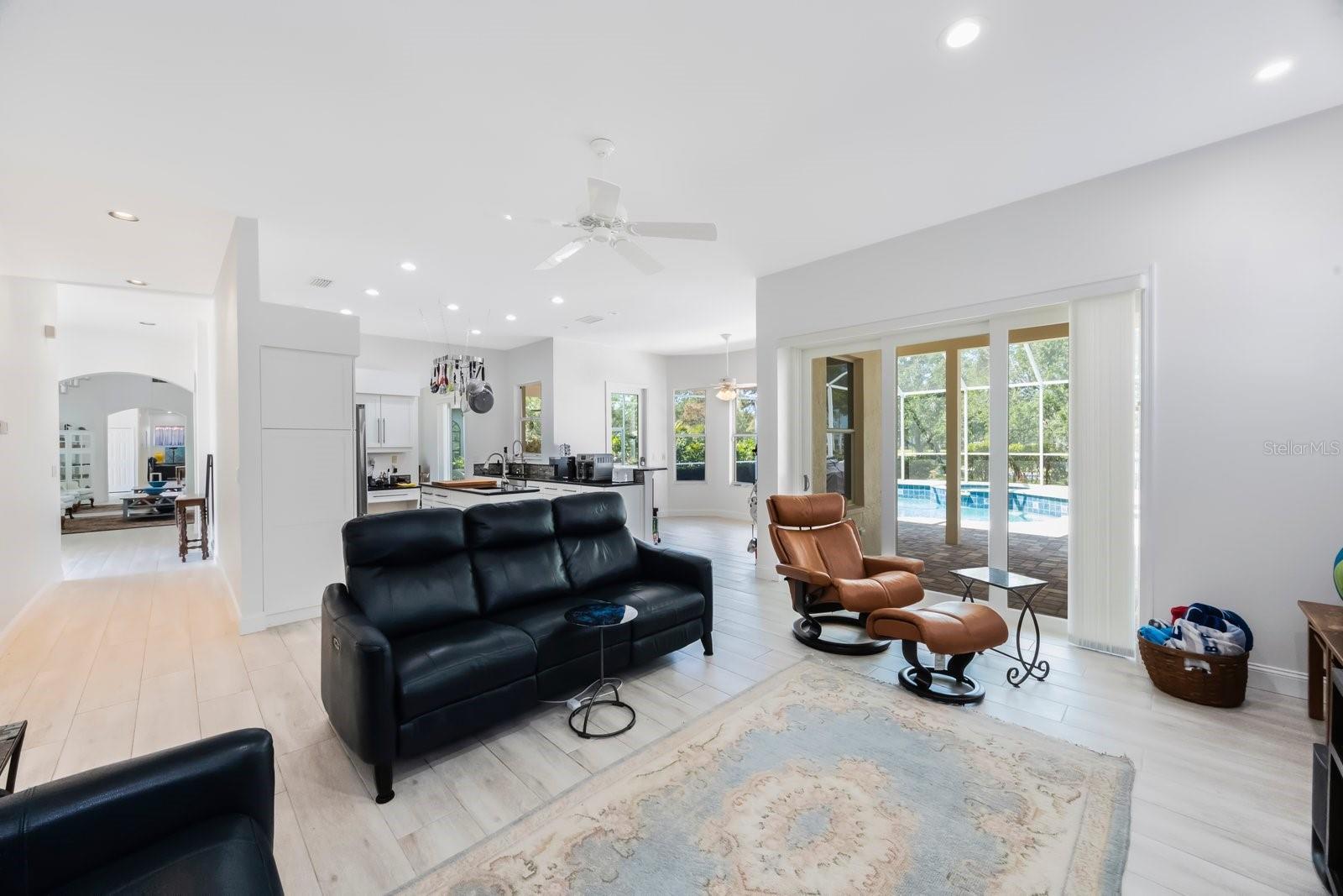 Hurricane proof triple sliding glass doors lead to lanai and can pocket to disappear for entertaining