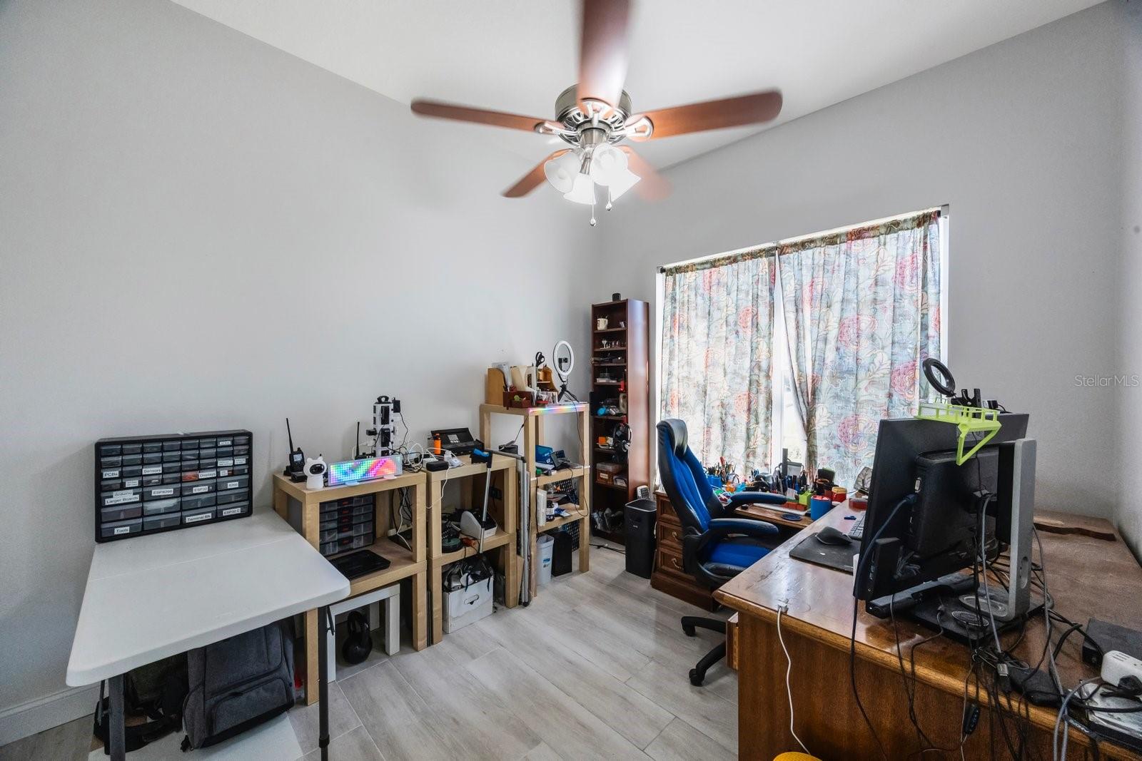 Fifth bedroom/office downstairs currently serves as an engineer's office.  Access to full bath on this floor.