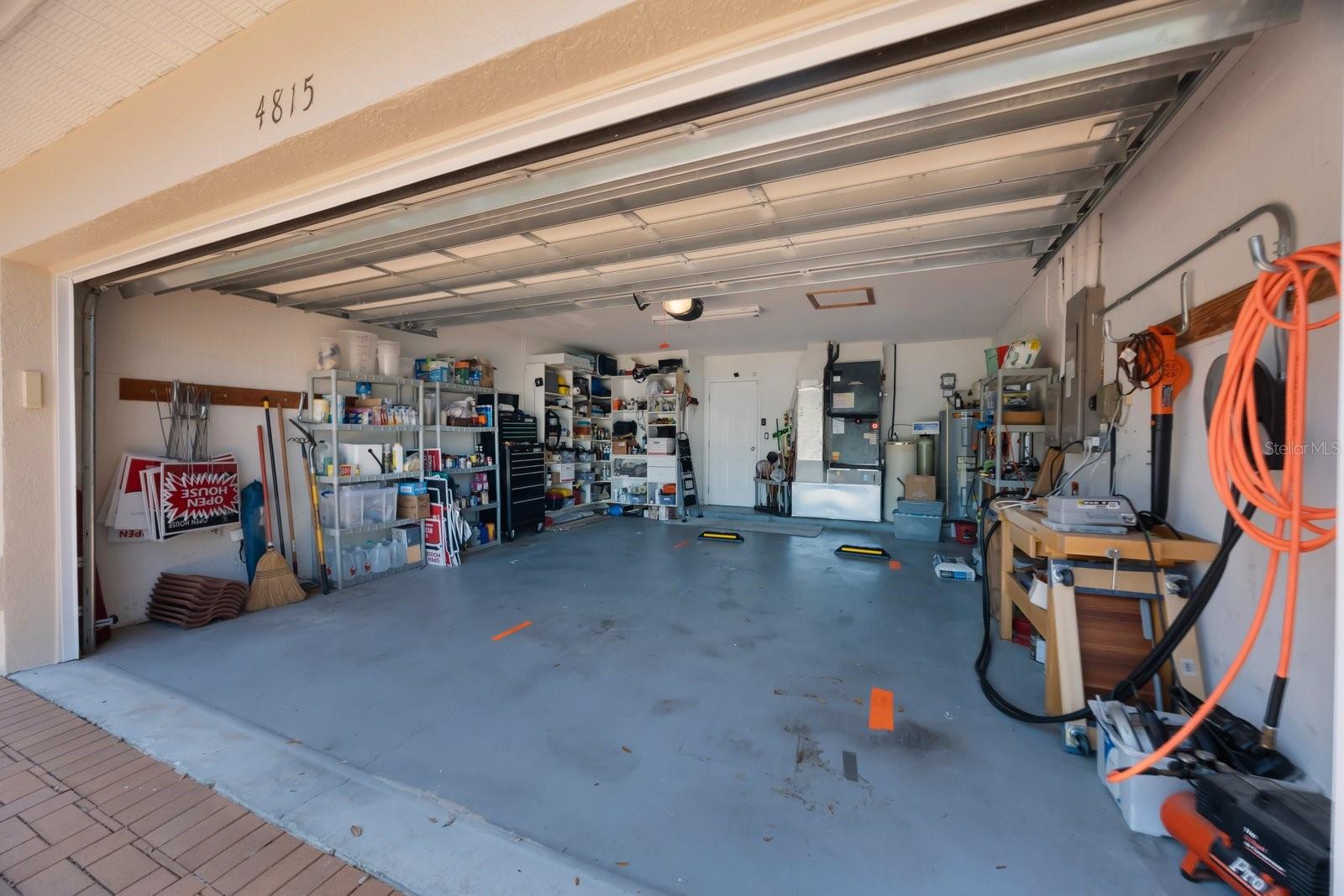 Extensive two car garage.  A/C air handlers and hot water heater located here.