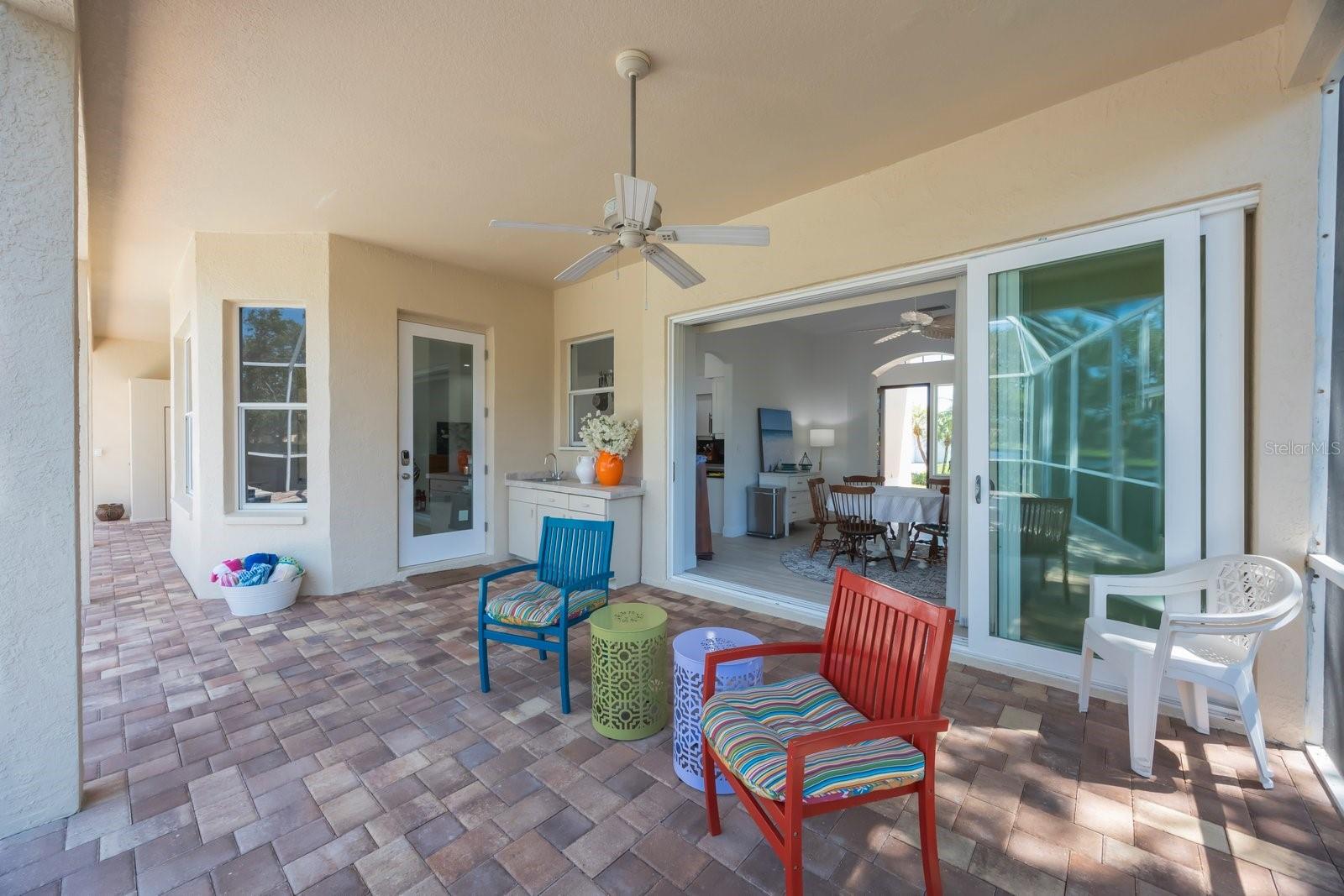 Sliding doors from dining room and single door from breakfast room (all hurricane rated) lead to lanai with great views of the lake and pool