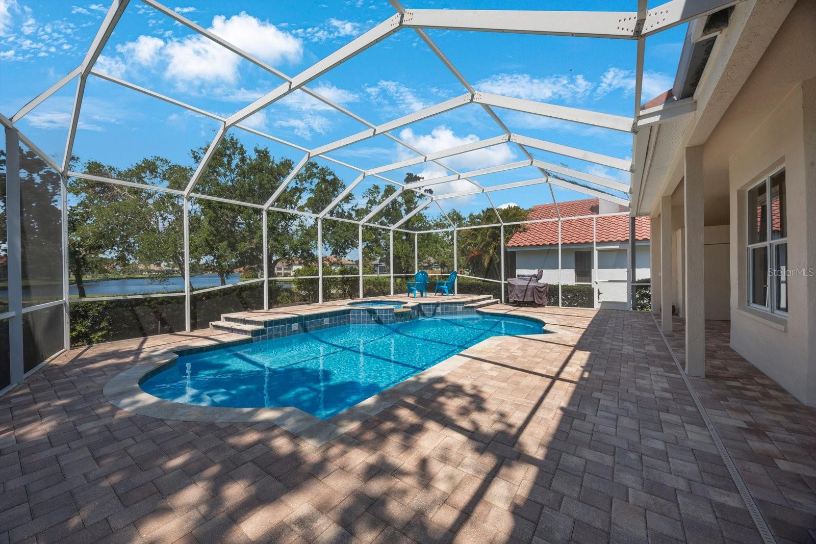 Oversized lanai large enough for lounges and a dining table and chairs
