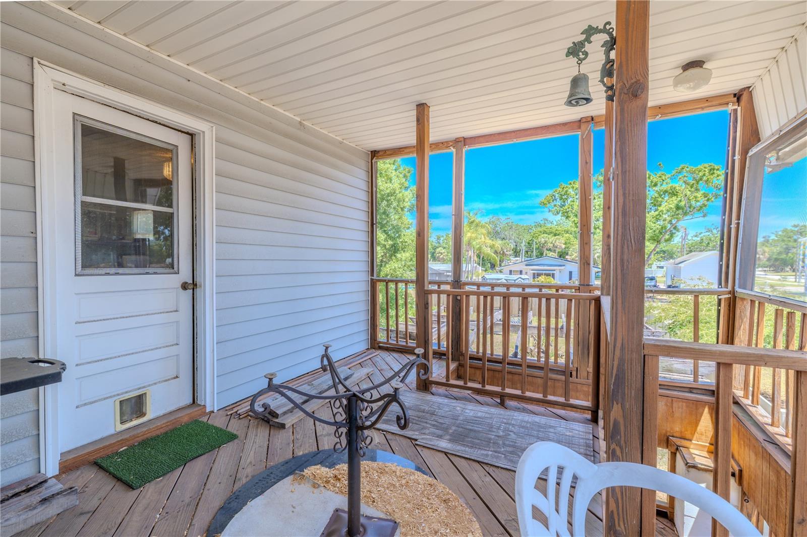 The second level (Main Living area) features a covered deck.
