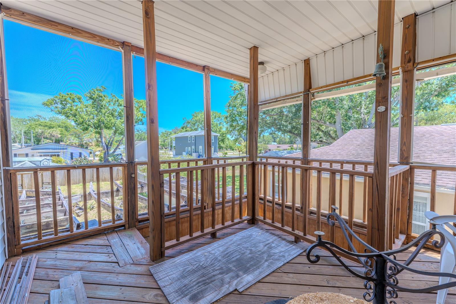 The second level (Main Living area) features a covered deck.