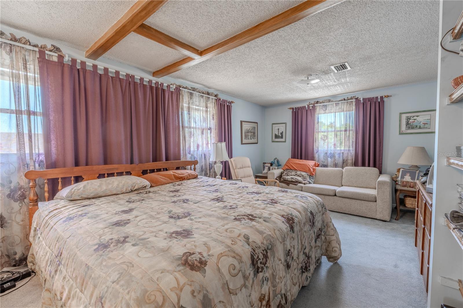 The primary bedroom features carpet and end ensuite bath.