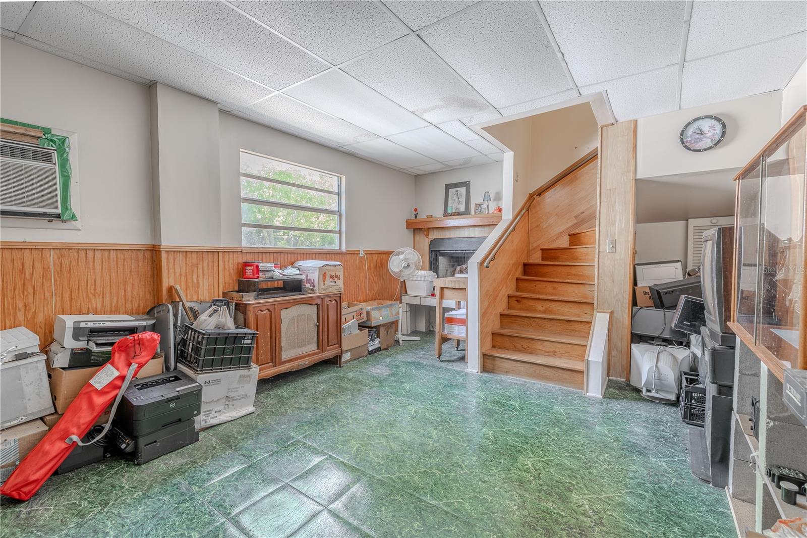 Bonus room on first level with wood burning fireplace.