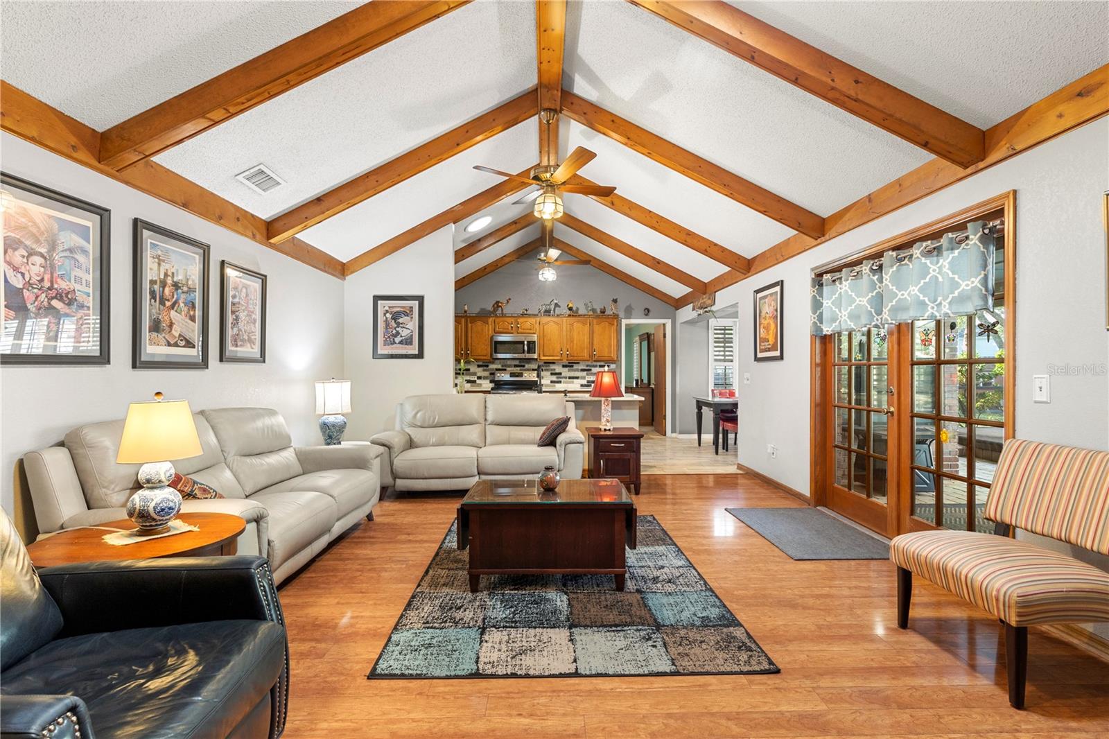 Living Room features vaulted ceilings with wooden beams