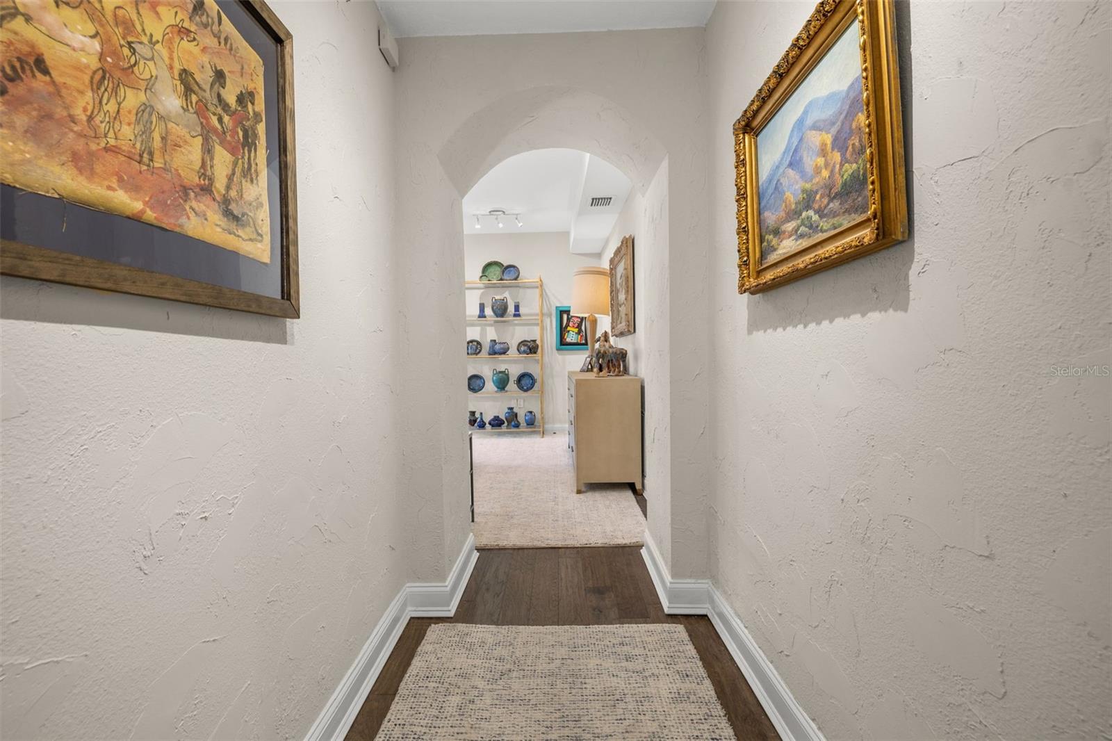 Entrance to the primary suite just off the foyer