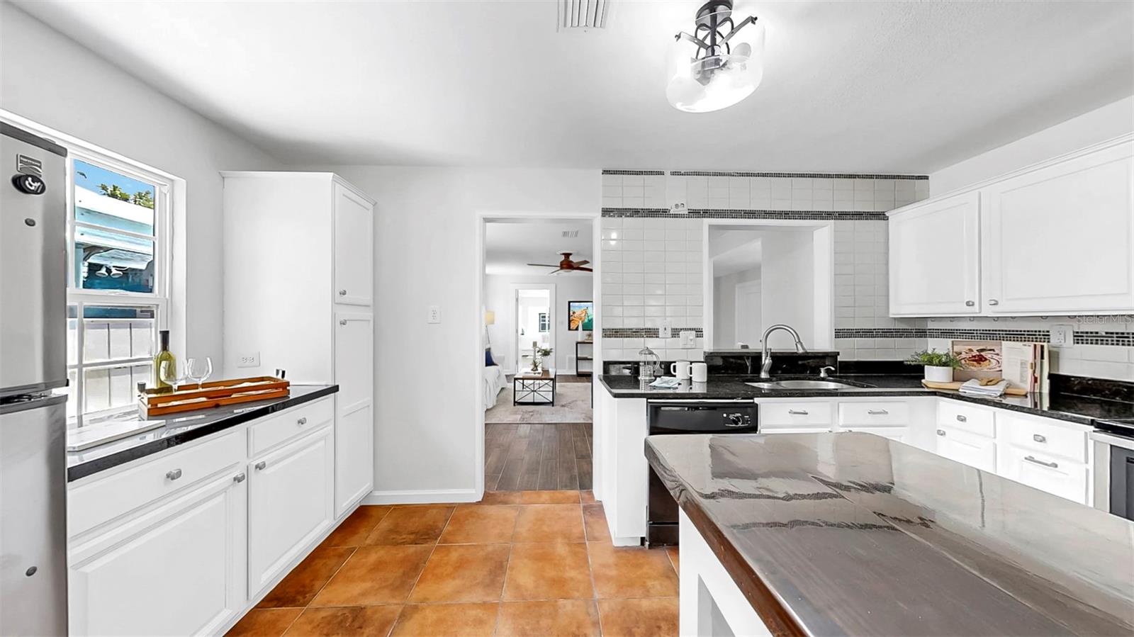 Kitchen opens to main living space for easy flow.
