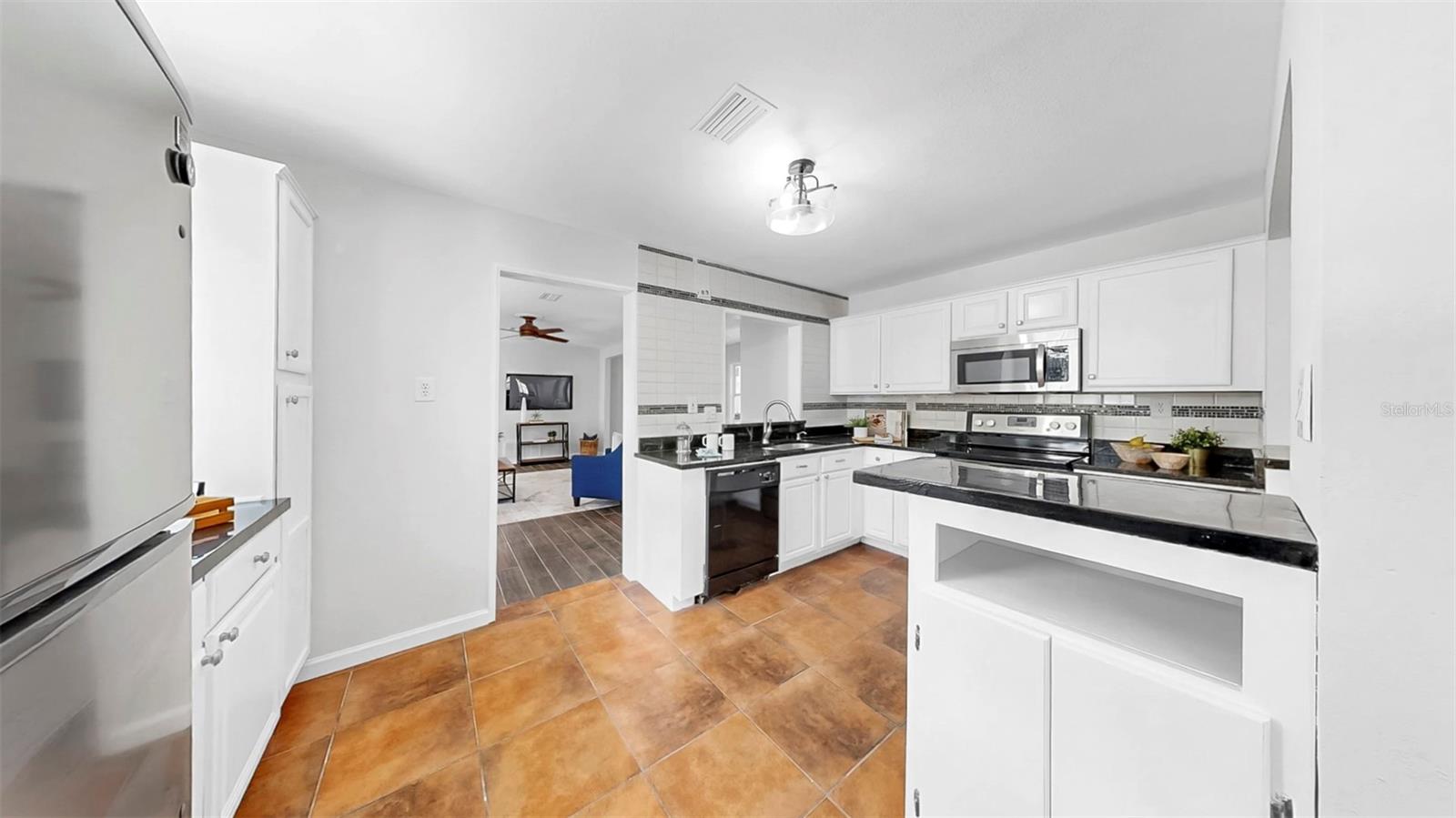 Kitchen is bright with lots of storage!