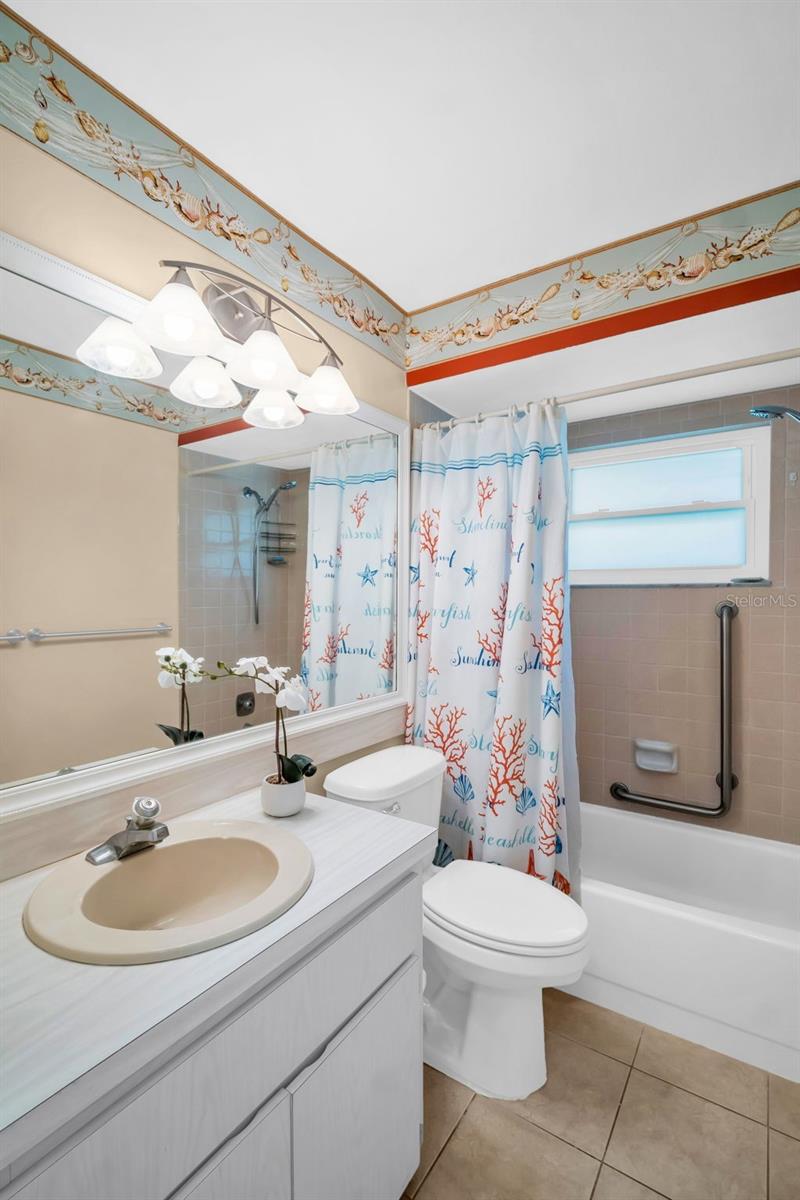 Hall bath conveniently located between main living & guest suite~