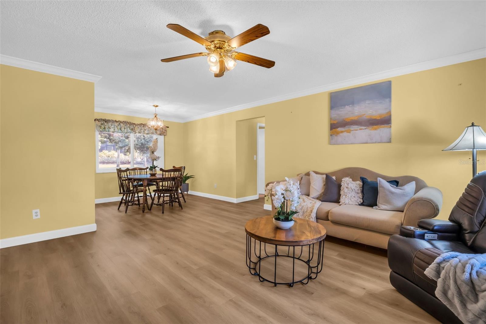 Welcoming entry with BRAND new luxury vinyl flooring & beautiful crown molding throughout~