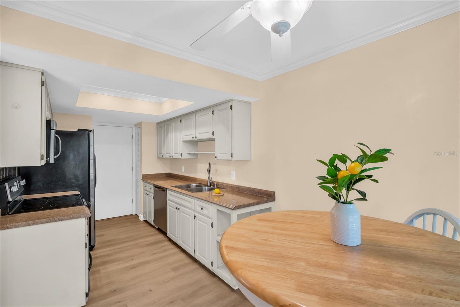 Sleek stainless appliances, pantry closet, & updated tray ceiling with recessed lighting~