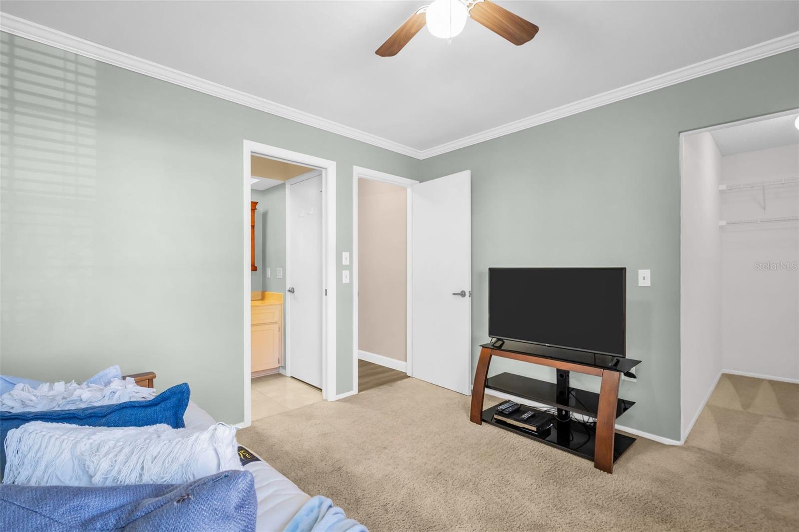 2nd bedroom conveniently offers both a walk-closet and bath access~