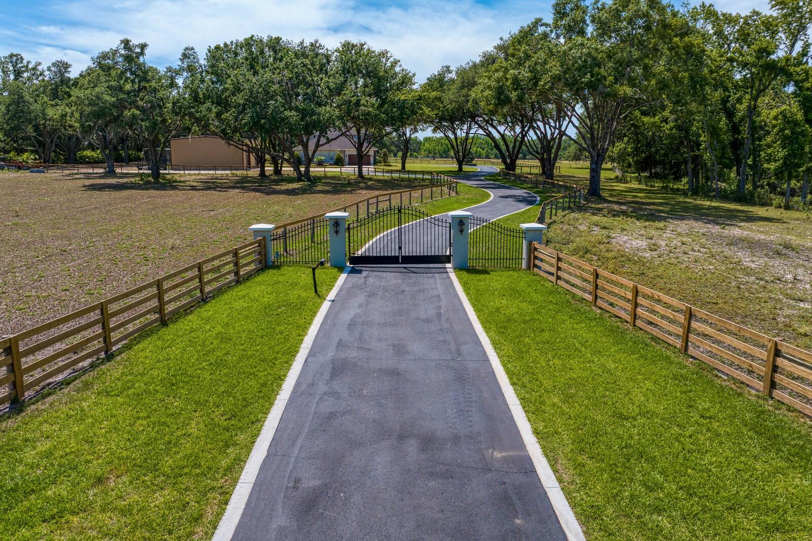 Private gate and winding circular driveway!