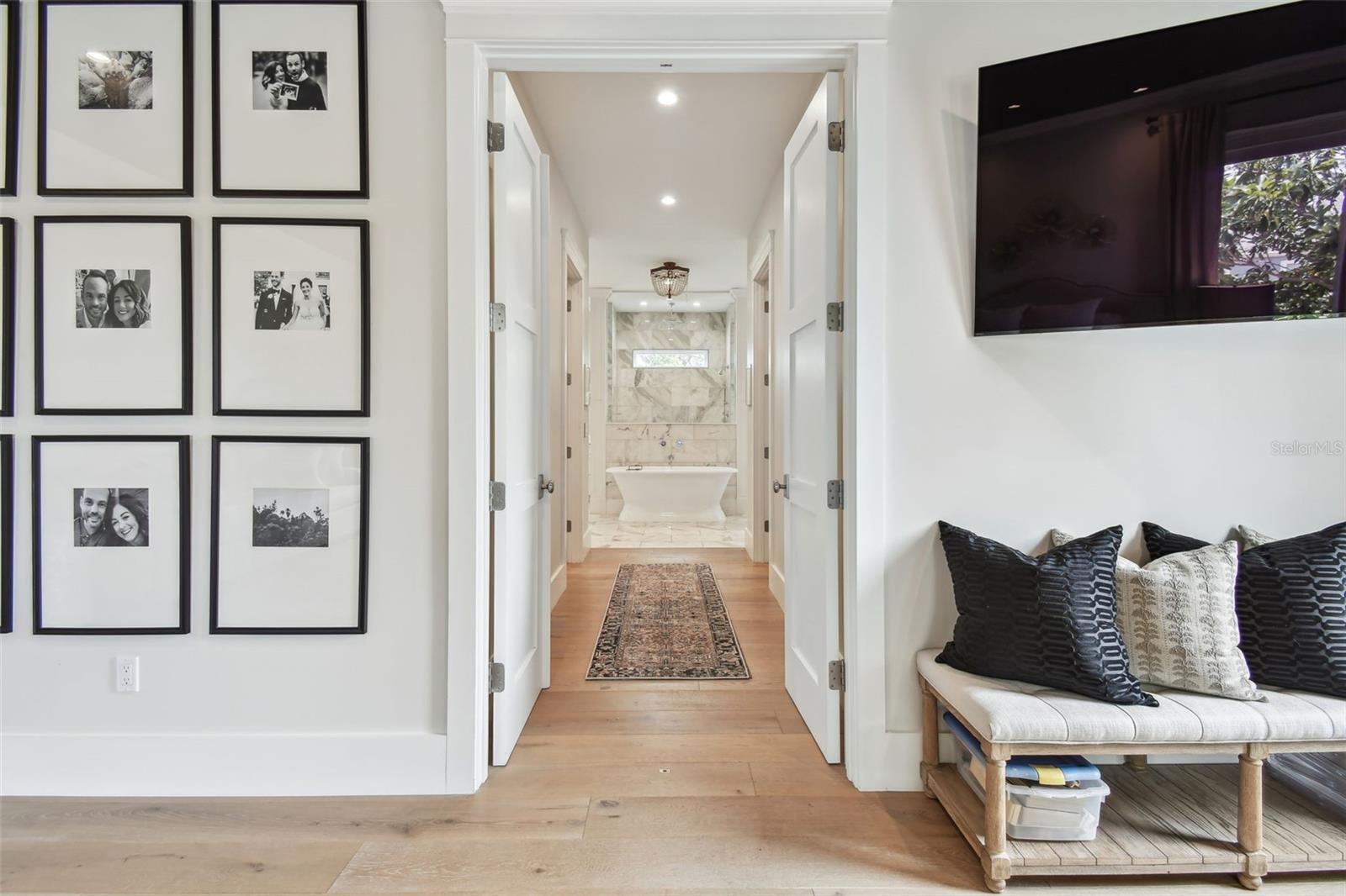 Hallway to Bathroom w/ Dual Spacious Walk-in Closets