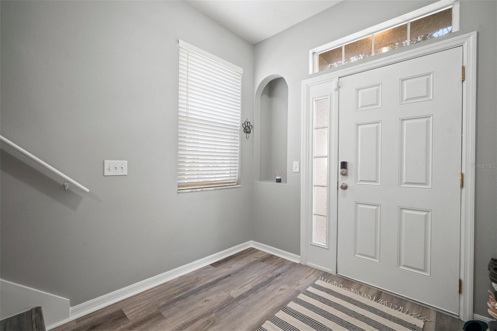 First floor entrance and downstairs bonus room and laundry with half bath