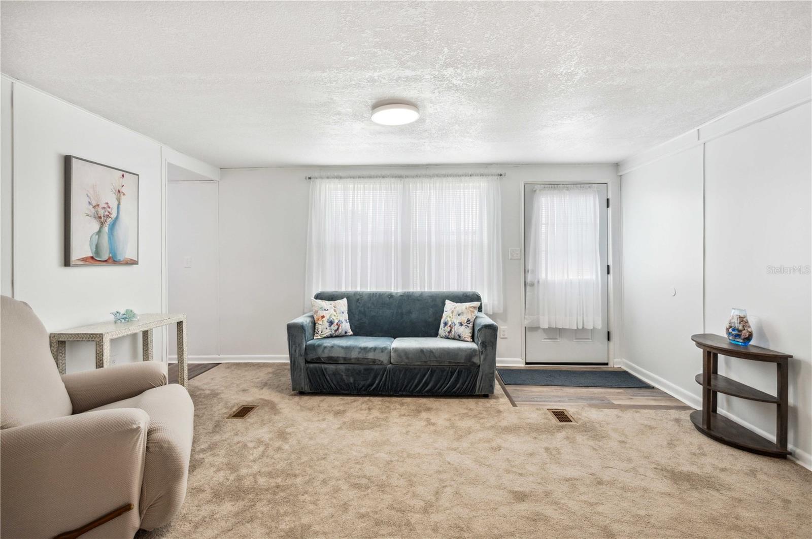 Updated ceiling, walls, flooring in this home.