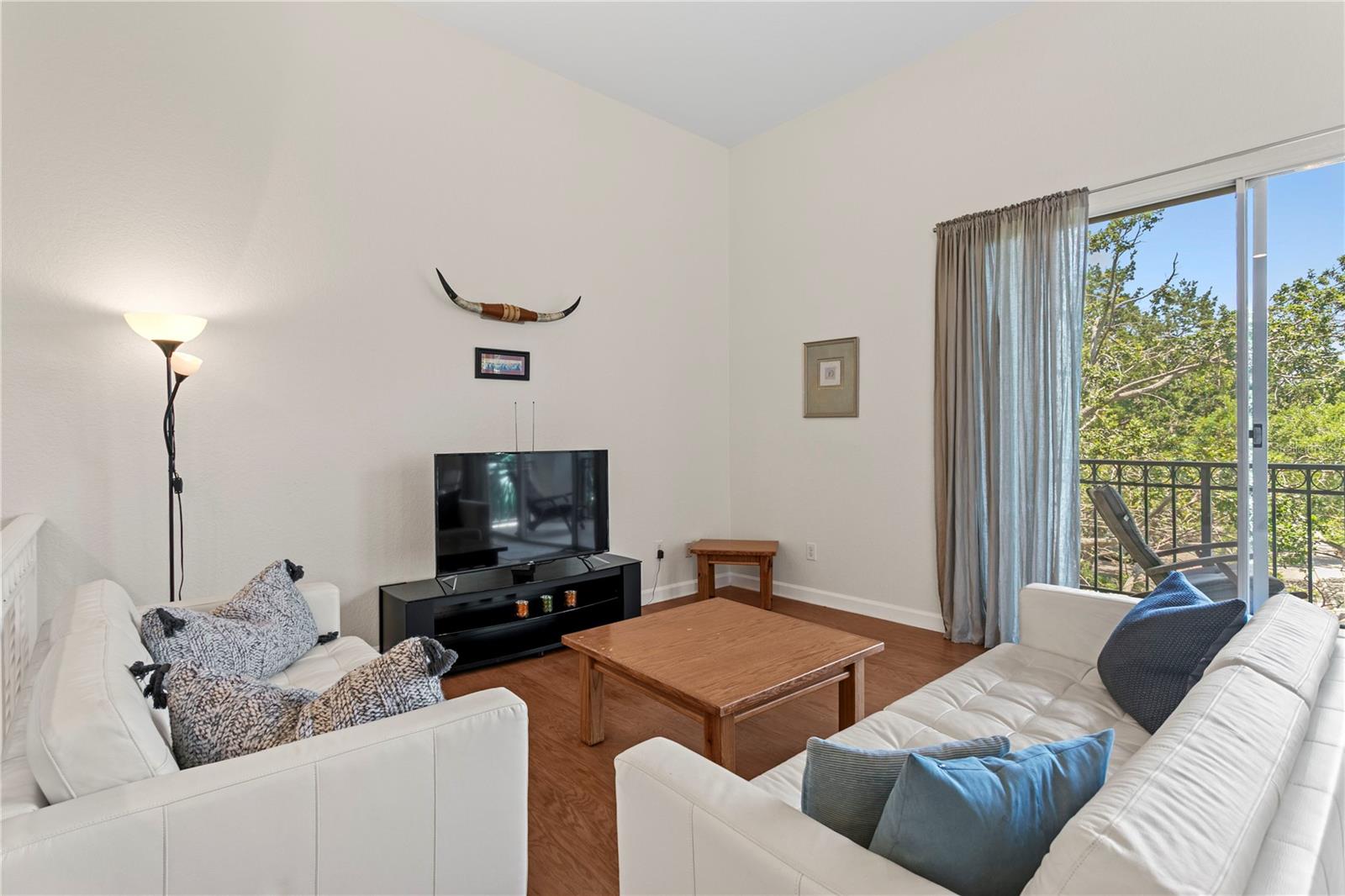As you arrive you are greeted with soaring 10 + ceilings and stairs that lead you to the open concept living room....