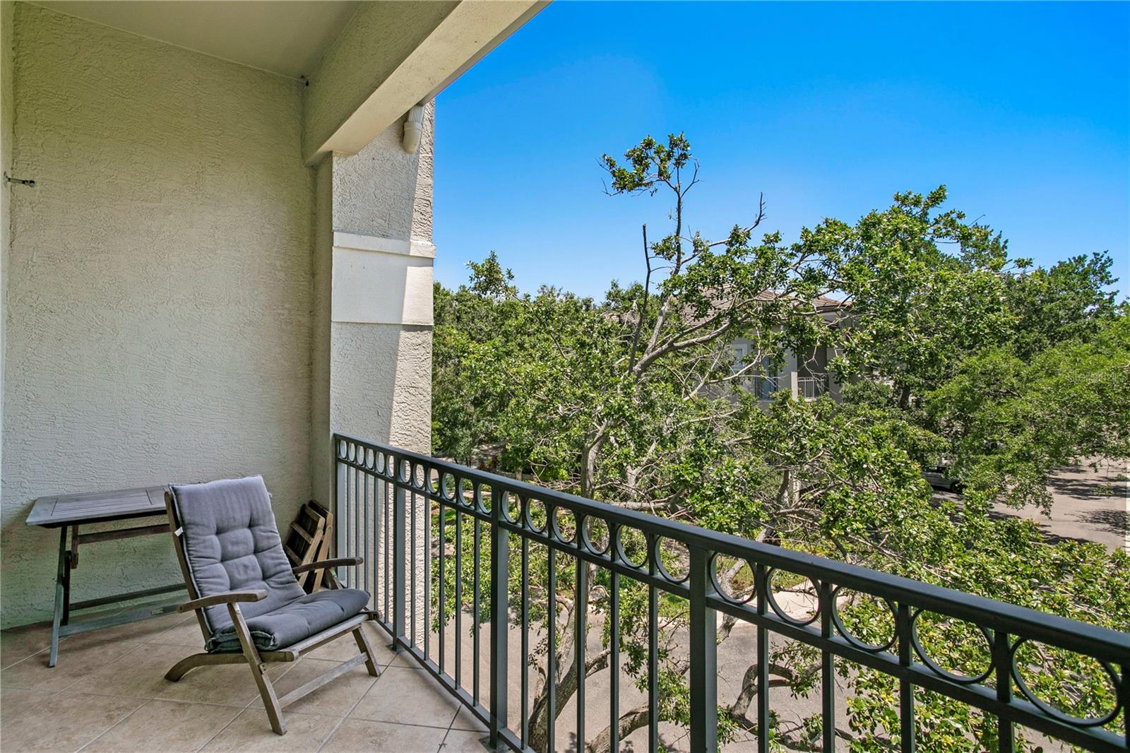 with access to a covered balcony to enjoy fresh air overlooking the community’s pond and fountain.