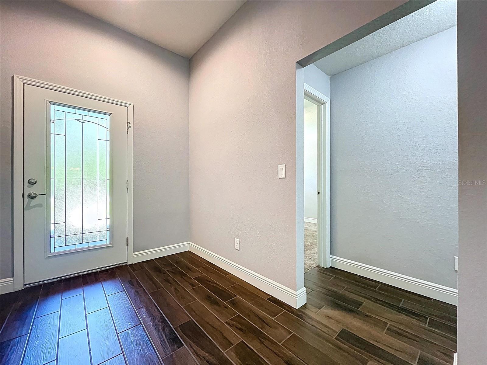 Bright and welcoming foyer with natural light.