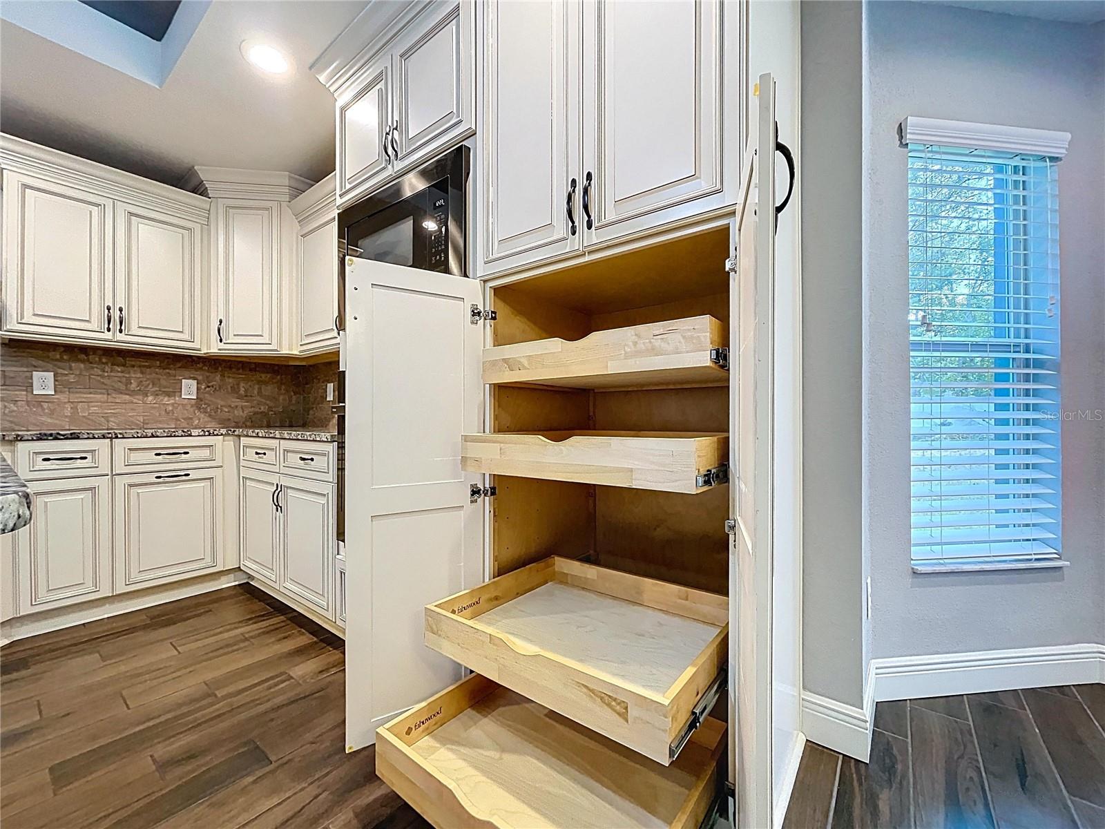 Custom white cabinetry with extra storage.